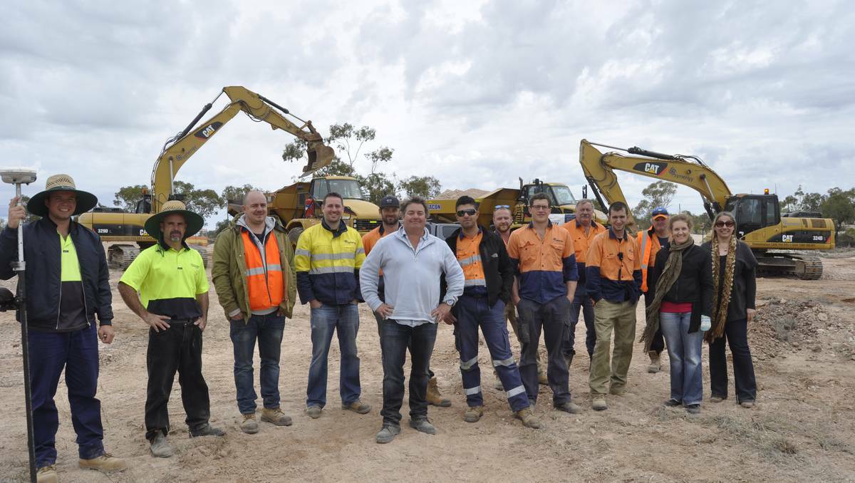 LIGHTING RIDGE: History is being made on the Three Mile opal field at Lightning Ridge, as ground is broken for the new Australian Opal Centre (AOC) building. Picutred: The Synergy team, centre, general manager Andrew Reardon, AOC manager Jenni Brammall and AOC 