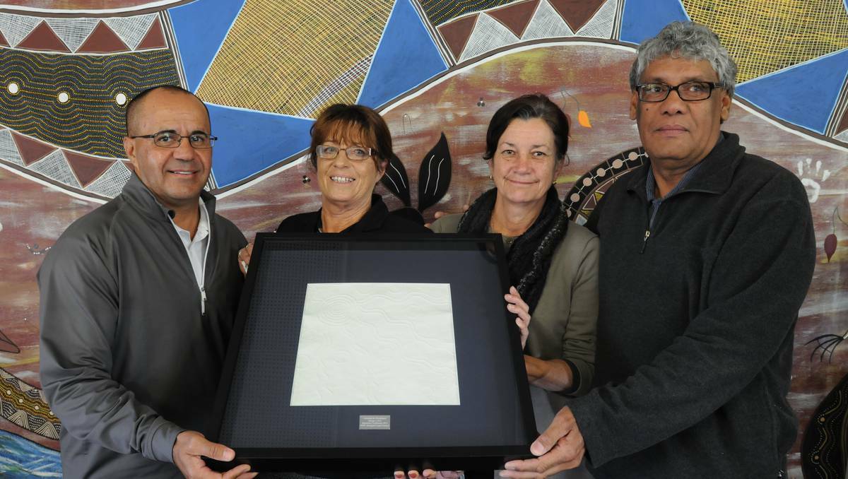 ORANGE: Orange Local Aboriginal Land Council director Jamie Newman, chief executive officer Annette Steele, board member Debbie Spicer and mentor support co-ordinator Neil Ingram with their award received last week. Photo: STEVE GOSCH 0703sglands2