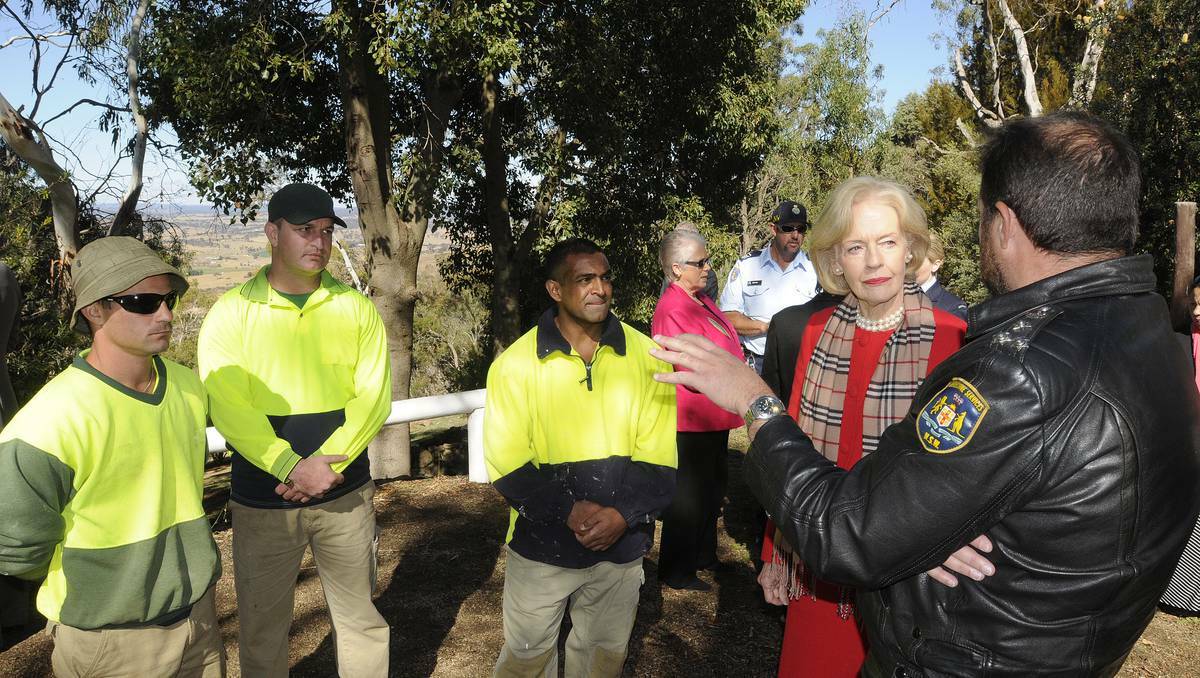 BATHURST: Bathurst Correctional Centre inmate Aveen Kumar speaks with Governor-General Quentin Bryce and Bathurst Correctional Centre’s governor Bill Fittler at the Wahluu Gamarra Reserve at Mount Panorama yesterday. Photo: CHRIS SEABROOK 051413cggv2