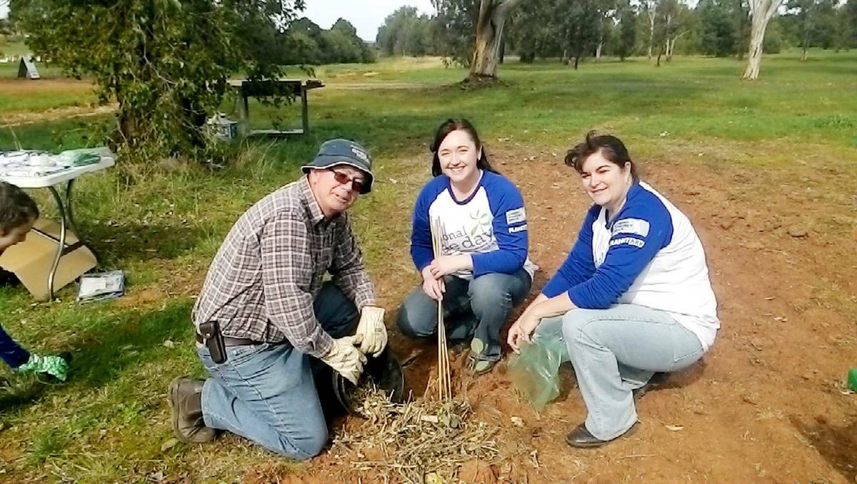 Parkes Shire Councillor Bob Haddin, Marg Applebee (CWLL) and Kath Mann (PSC) kept busy planting trees near the Parkes Cemetery on National Tree Day last Sunday.