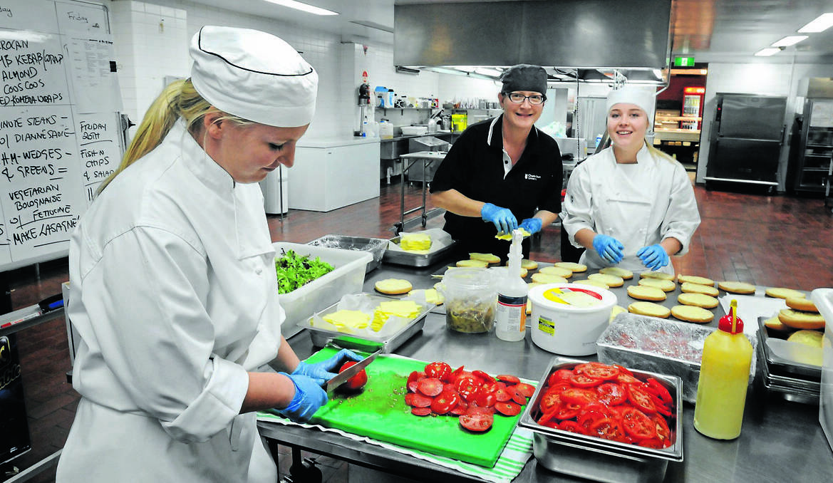 Blayney High School students Mikaela Hopkins and Georgie Nixon with (middle) Banjo's Cafe chef Mandy Rogers. The students are part of a renewed interest in the hospitality industry. Photo: STEVE GOSCH 0916sghospitality3