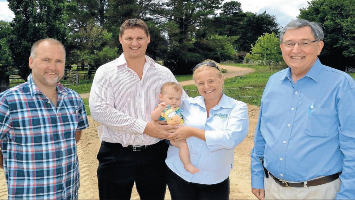 Deputy mayor Ian North, Quinn and Narissa King with seven-month old Bella and developer Bruce Bolam on the Stanley Street site of the new Milestones Early Learning Centre. Photo: CHRIS SEABROOK