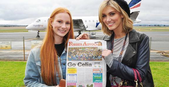 Forbes-born and raised singer Celia Pavey and her coach on The Voice, Delta Goodrem arrived in the Central West for a flash tour of the songstress’ home town and school. Celia Pavey and Delta Goodrem are pictured here with a copy of the Forbes Advocate, which has been right behind Celia's quest to win The Voice.