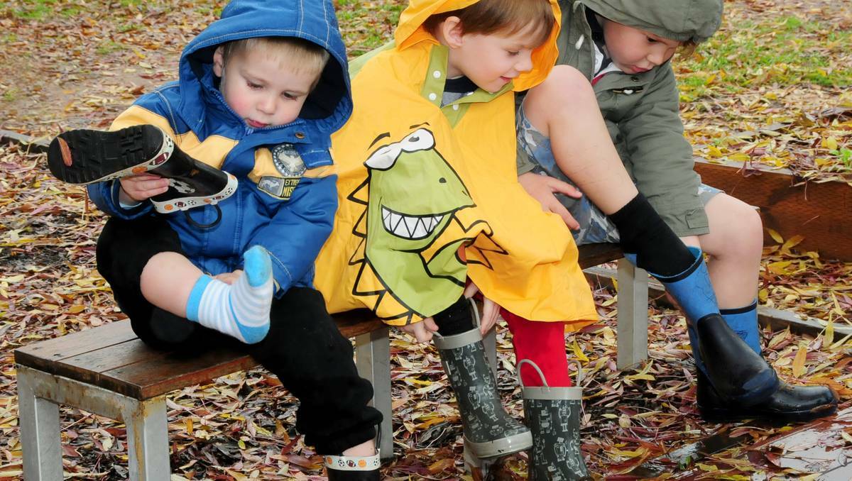Gearing up for wet weather play at Dubbo's Rainbow Cottage childcare centre on June 7 were Austin Reynolds, Angus Mein and Tate Wootton. Photo: LOUISE DONGES