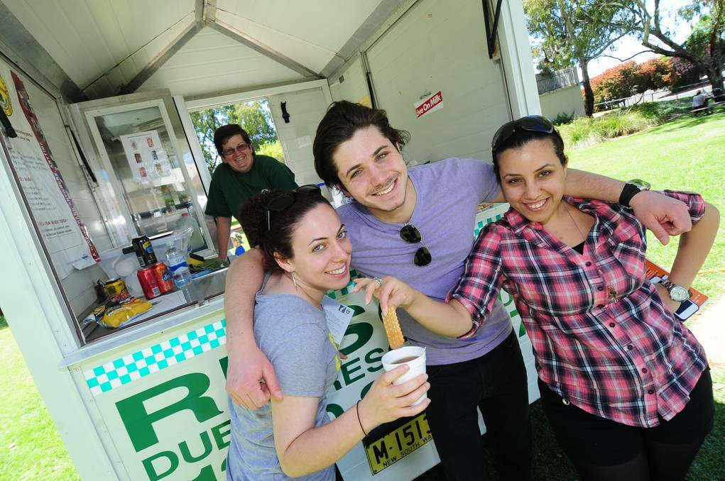DUBBO: Israeli visitors making the most of the Dubbo Driver Reviver were Melody Simon, Eden Boushousha and Batami Getz with Dubbo VRA volunteer Jenny Chenhall serving the tea and biscuits. Photo: LOUISE DONGES