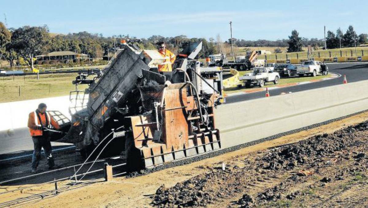 BATHURST: Contractors for Bathurst Regional Council were at Mount Panorama on Tuesday with specialist equipment for a massive concrete pour on the new outer barrier along Pit Straight. Photo: PHILL MURRAY 070213pconcrete