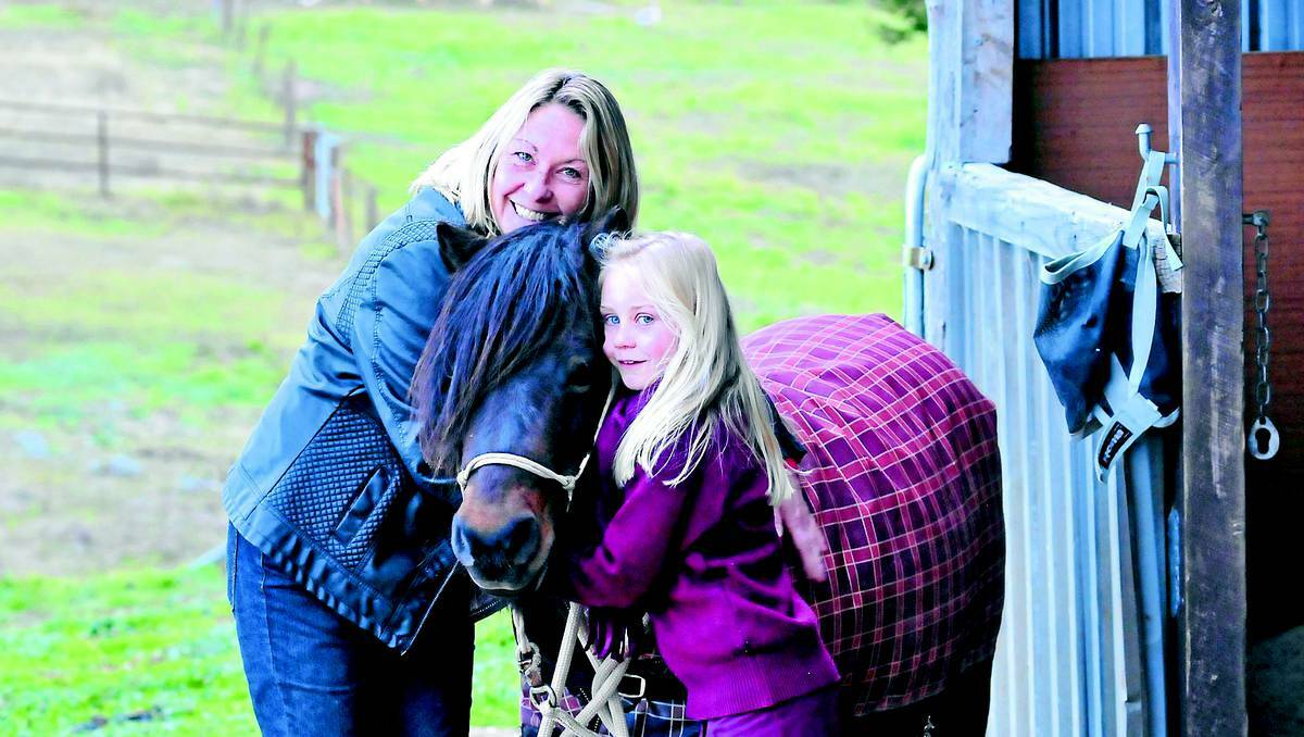 ORANGE: Justeene Cleary and her daughter Cara Crowley hope a safe haven will be in place by next summer for horses and family pets that could potentially be caught up in a bushfire. Photo: JUDE KEOGH 0617clifton1