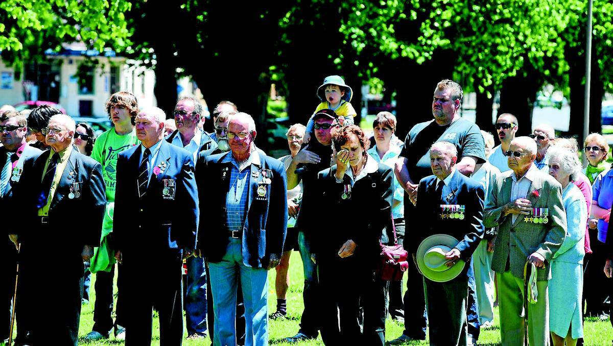 A large crowd commemorated Australia’s war efforts at a ceremony in Robertson Park in Orange last year. Photos: STEVE GOSCH 1111sgremember1
