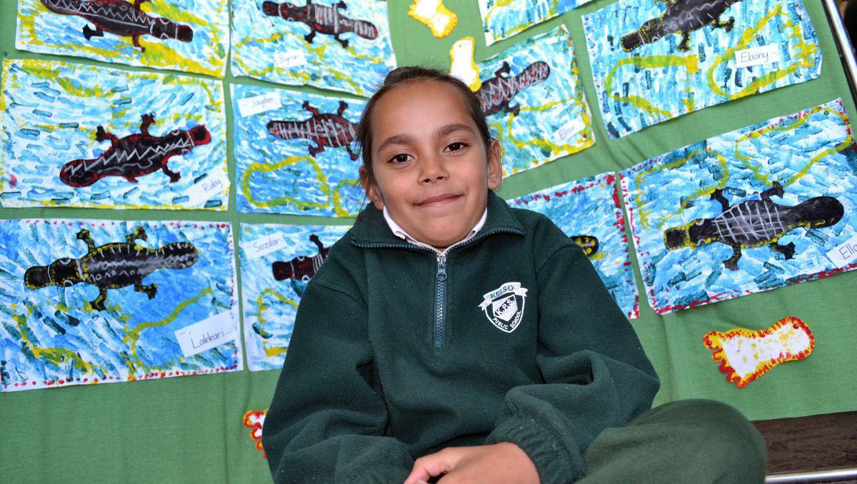 BATHURST: Kelso Public School student Tashara Mackay,8, at the Bathurst Memorial Entertainment Centre with just one example of the artworks that are being displayed in the upstairs foyer for the next week.