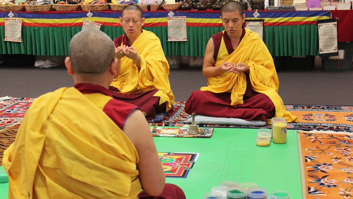 COWRA: Monks performing religous chanting and mediation before creating the mandala.