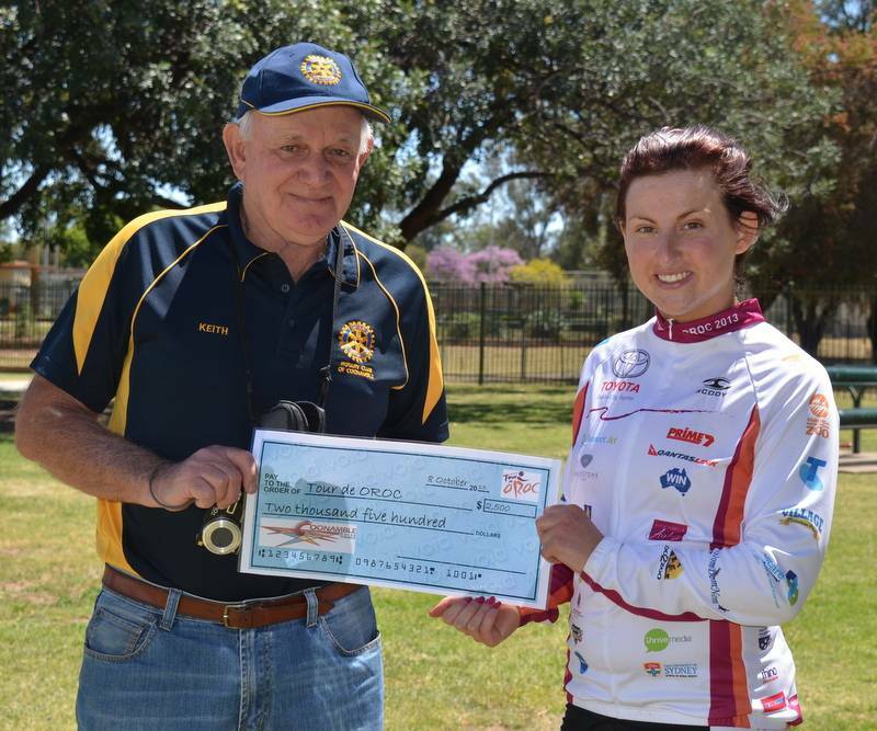 DUBBO: Keith Glover presents a cheque to Megan Dunn as part of the Toyota Tour de Oroc Photo: CONTRIBUTED.