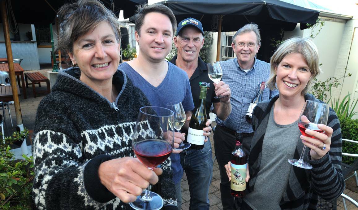 ORANGE: Wine producers Loretta Svenson, James Thomas, Peter Mortimer, David Crawley and Pamela Harrison are thrilled wine consumption is about to overtake beer consumption in this country. Photo: STEVE GOSCH	 0919sgwine1