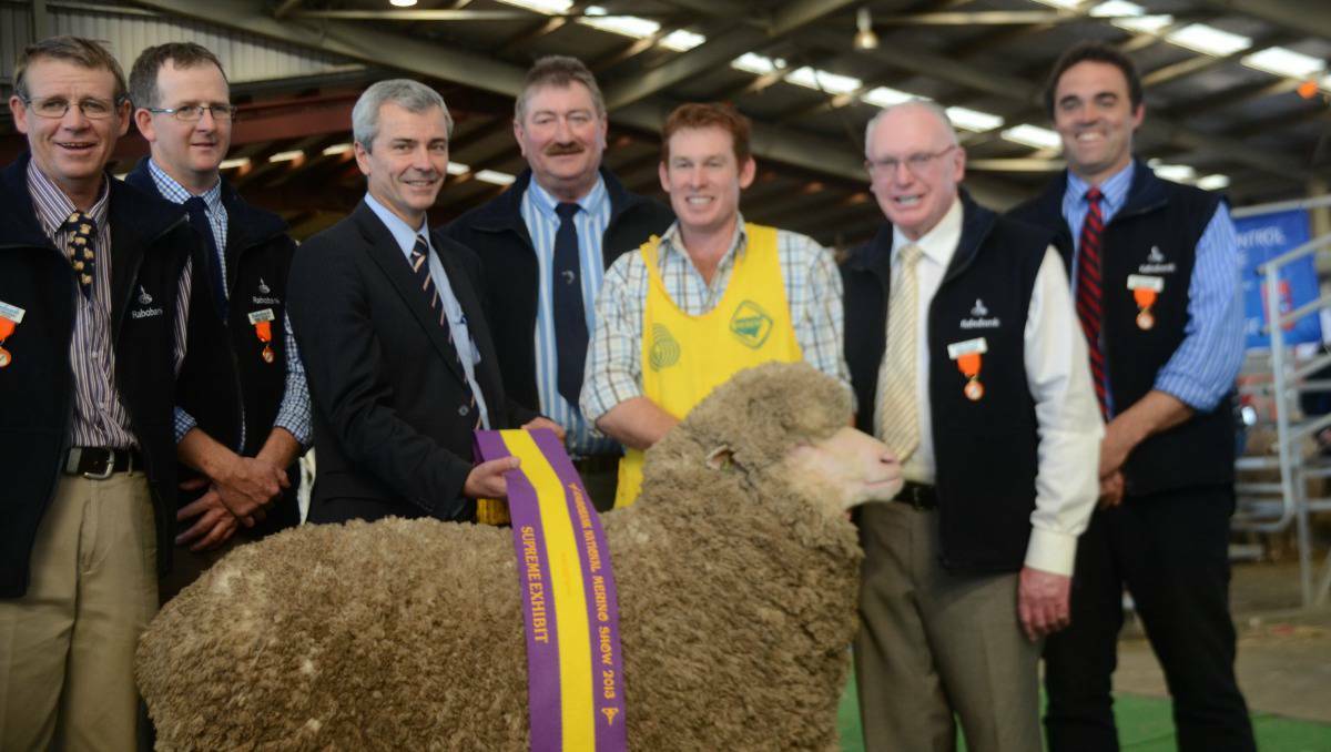 DUBBO: Matthew Coddington (checked shirt) with his grand supreme ewe, the judges and Peter Knoblanche, Rabobank Group Executive, Country Banking Australia.