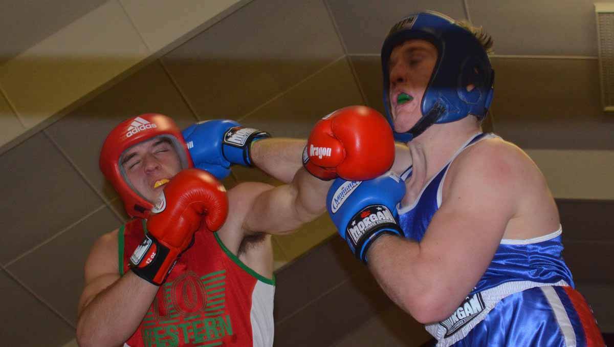 MUDGEE: Kandos-Rylstone’s Zac Doyle and Maitland’s Jarrod Harms get a punch on each other in a fight night on Saturday . Photo: BEN HARRIS 