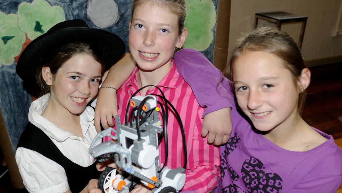 BATHURST: Perthville Public School Year 5 students Kaysha Edmonds, Grace Priestly and Taya Patching with their robot, affectionately known as Fluffy. Photo: CHRIS SEABROOK	 061113crobot