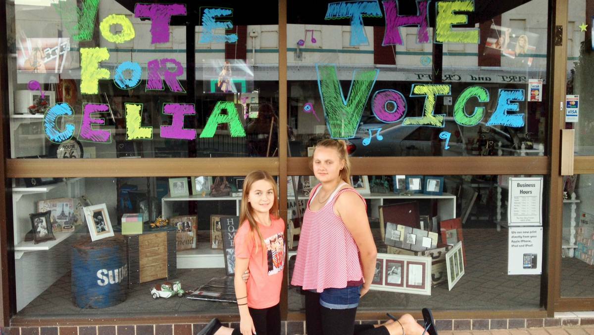 FORBES: Celia Pavey supporters Cassey Dukes and Payton Reedy decorated The Fotoshop Forbes’ window on Saturday in the hope people will vote for her. Celia works at The Fotoshop when she comes home.