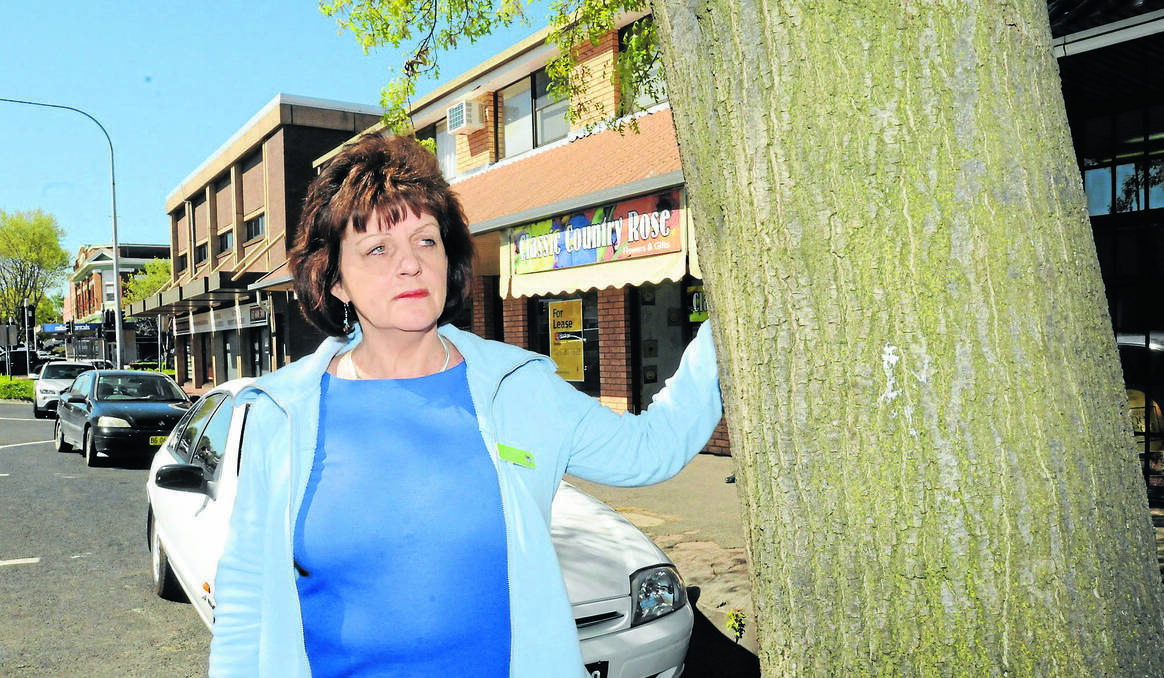 ORANGE: Classic Country Rose owner Sheryl Lewis believes its worth the cost of removing a tree outside her shop in Sale Street to free up space for more parking. Photo: MARK LOGAN 