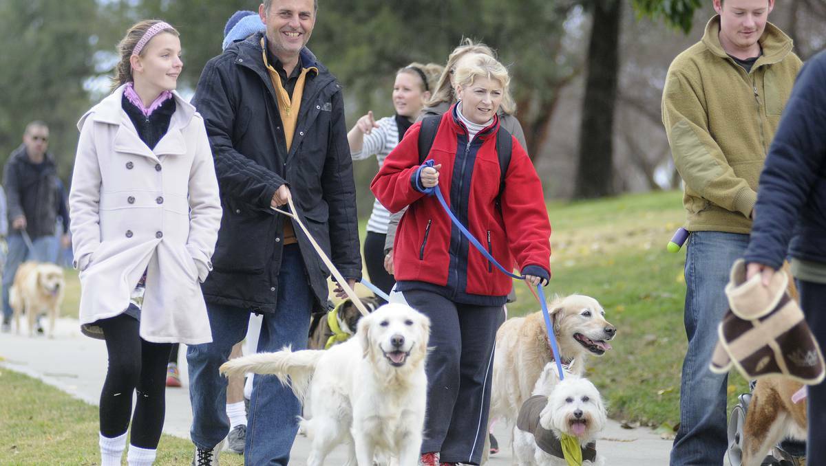 BATHURST: Local identity Tony Thorpe (centre) was spotted among the crowd at yesterday's Million Paws Walk on the banks of the Macquarie River. Photo: CHRIS SEABROOK 051913cpaws11