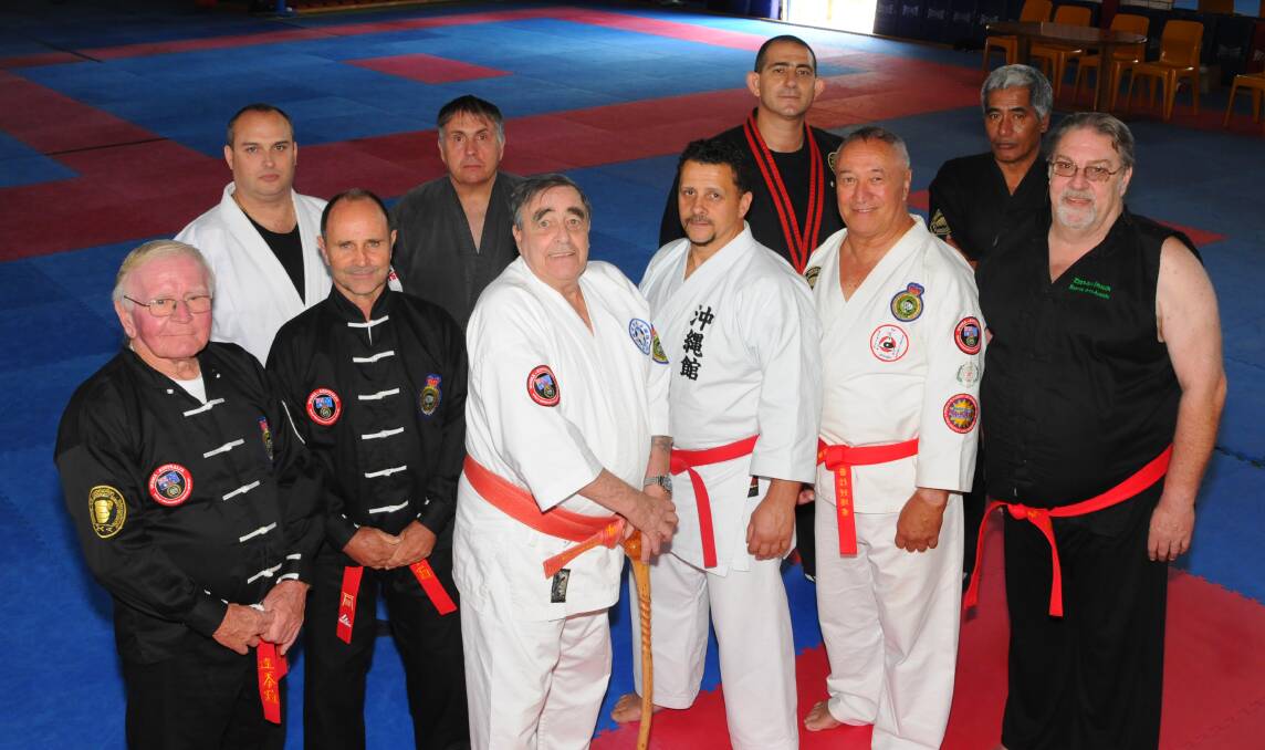 SELECT GROUP: Hanshi Ian Pollet (front row, third from right) with a handful of the grandmaster instructors who were on hand to pass on their knowledge at the Pollet’s Bathurst dojo on the weekend. Photo: ZENIO LAPKA 	102812zpollets
