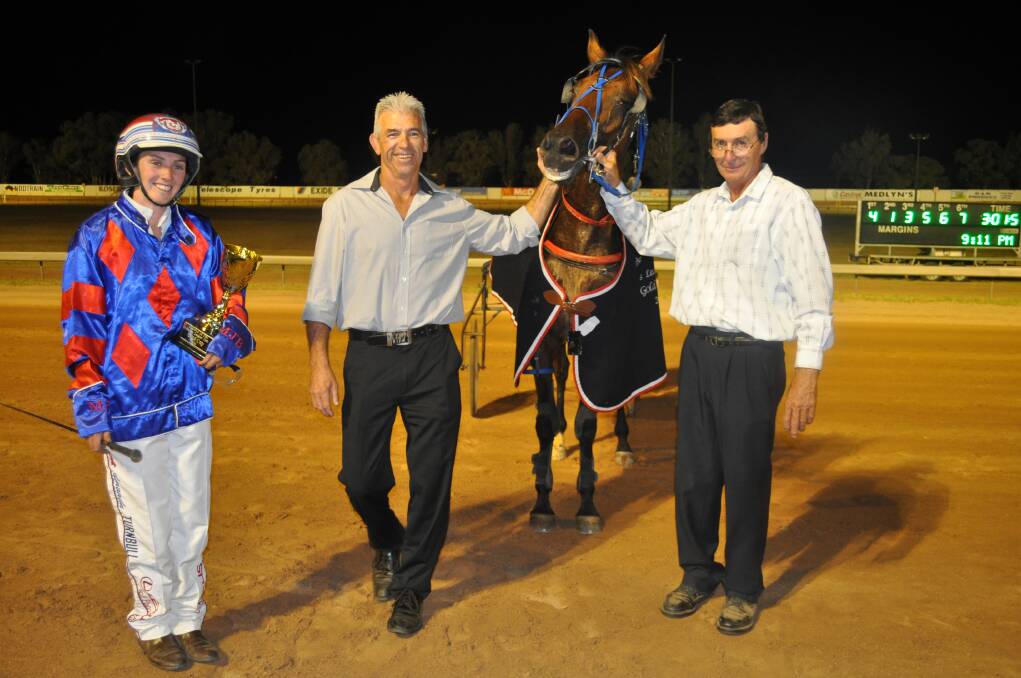 NOTCHED UP ANOTHER ONE: The Lagoon driver Amanda Turnbull (left) took out the 2013 Parkes Gold Cup on Friday night. The winners are pictured with Parkes Leagues Club CEO Steve Miller (sponsor) and Parkes Harness Racing Club President Geoff Cole. 	010412turnbull