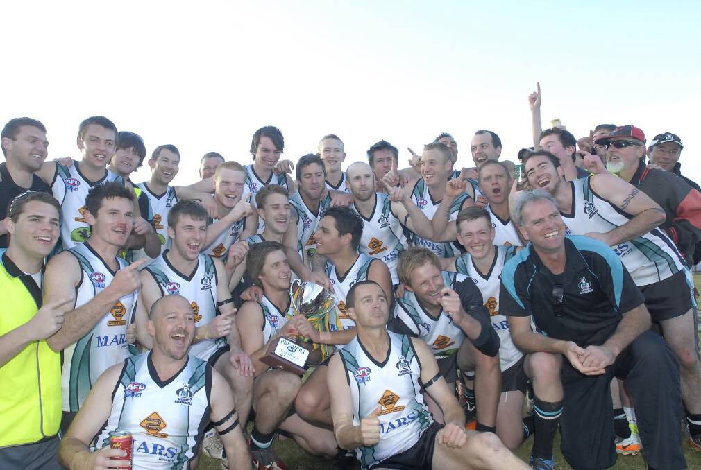 YOU BEAUTY: The Bathurst Bushrangers were elated after winning the 2012 Central West AFL grand final over Cowra at George Park on Saturday afternoon. Photo: CHRIS SEABROOK 	082512caflgf11
