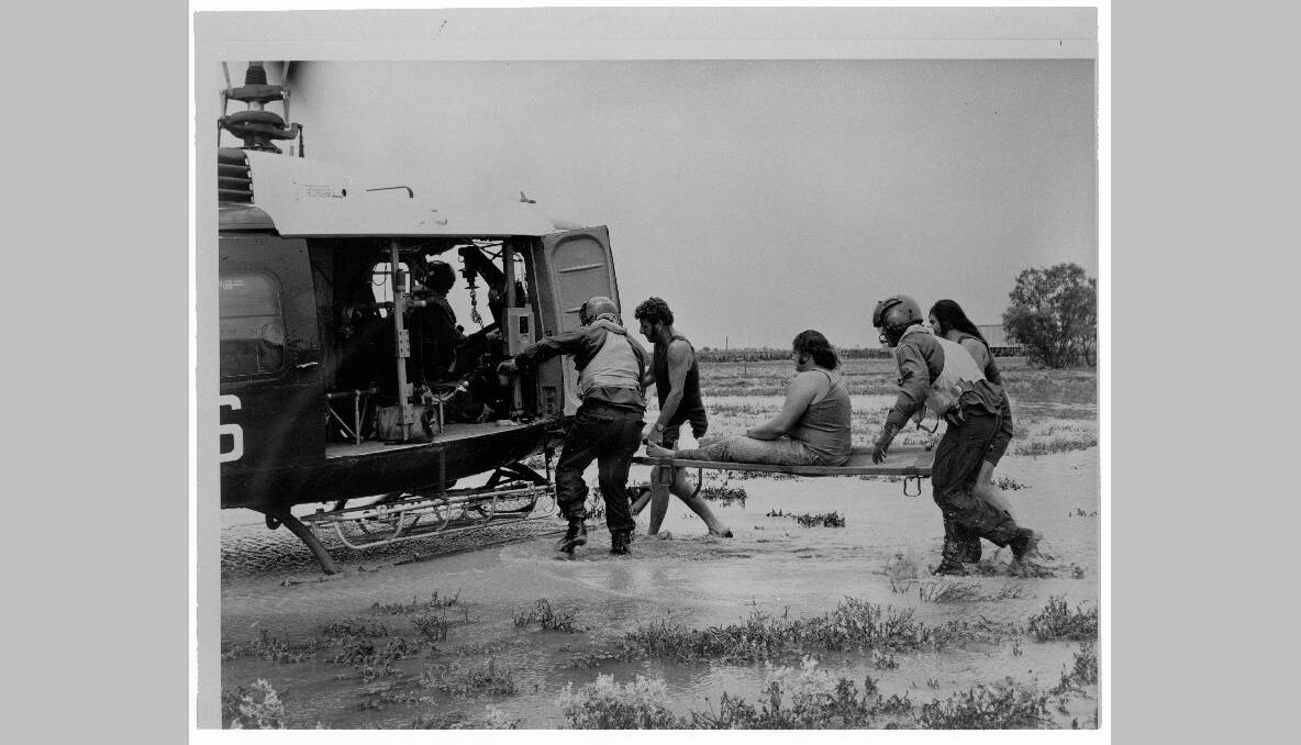 The Royal Australian Air Force evacuates flood victims from Lightning Ridge, 1974. Photo: National Archives of Australia