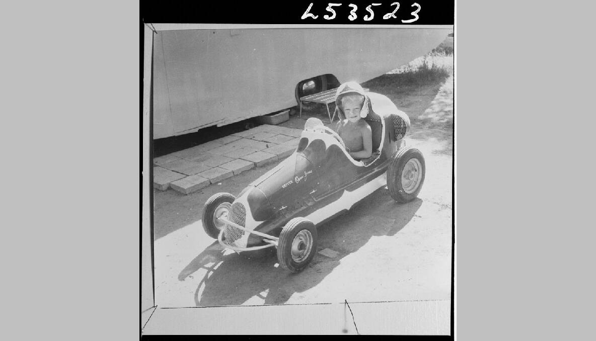 A boy drives a miniature race car in Bathurst, 1966. Photo: The National Archives of Australia