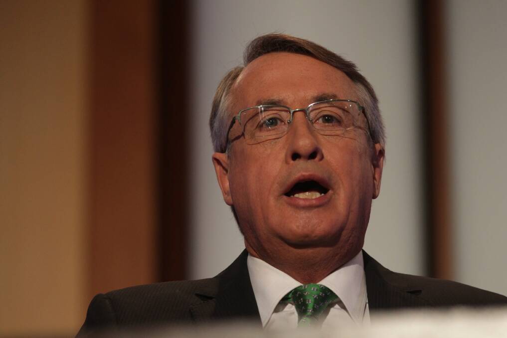 Treasurer Wayne Swan delivers his post Budget address, at Parliament House in Canberra on Wednesday. Photo: Alex Ellinghausen