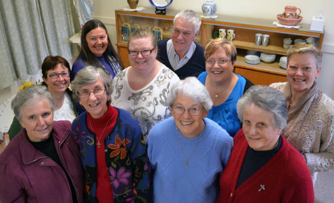 MILESTONE: NILS co-ordinators Julie Murnane, Judy Barker, Kellie-Ann Smith, Mike Dickson and Debbie Butwell with Josephite Foundation executive officer Kirsty Gilmore and, at front, Sisters of St Joseph’s past congregational leader Sr Mary Comer, current congregational leader Sr Therese McGarry, Sr Elizabeth Carroll and Sr Maureen Sanderson. Photo: JO JOHNSON 081213jjnils4