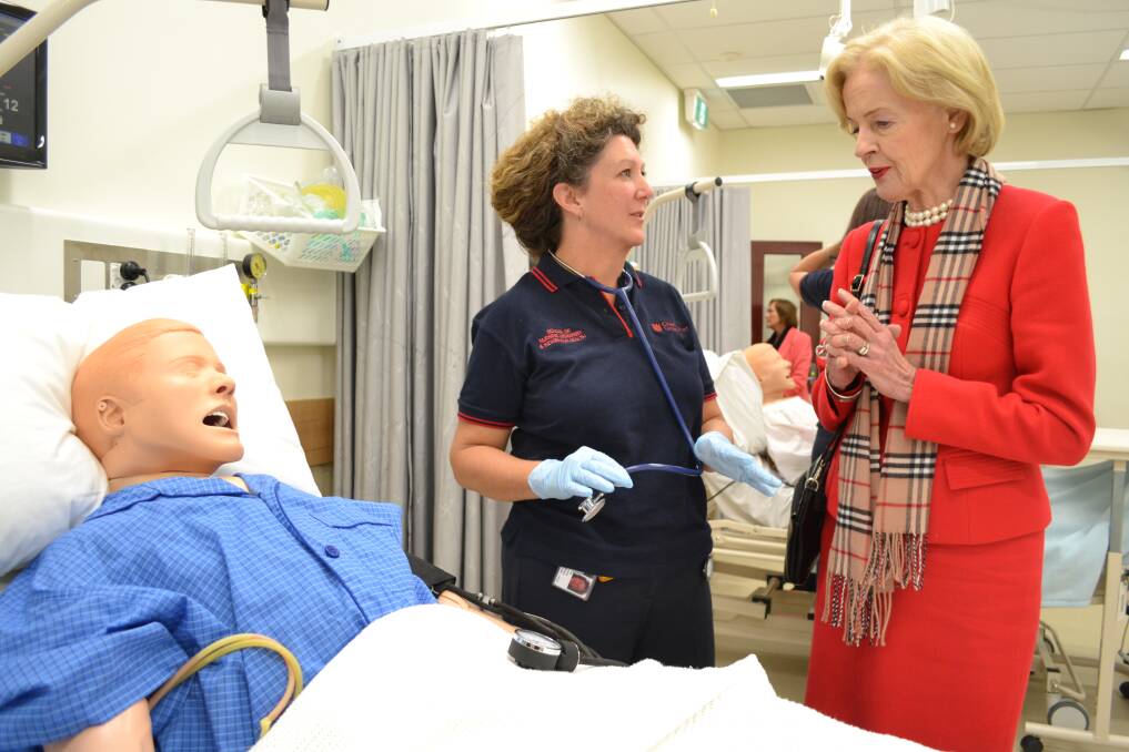 VIRTUAL REALITY: Governor-General Quentin Bryce chats with second year nursing student Lisa Mallard yesterday. Photo: BRIAN WOOD 051413ggnurse