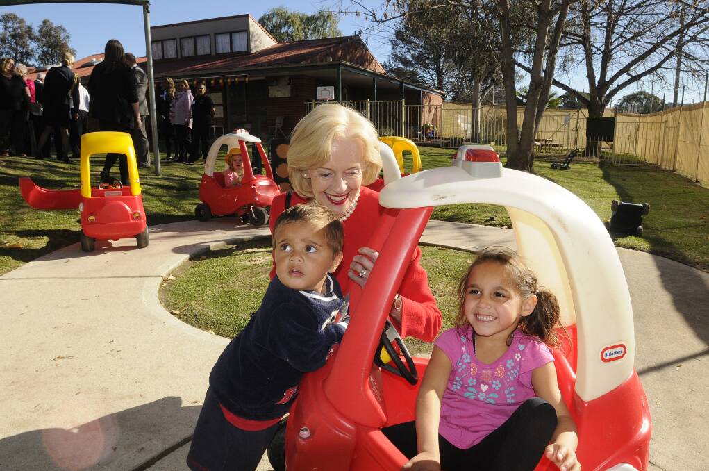 ANOTHER LITTLE RED CAR: Her Excellency Governor-General Quentin Bryce stops to play with Hayden and Kiara at Towri Macs yesterday.  Photo: CHRIS SEABROOK 051413cggv16a