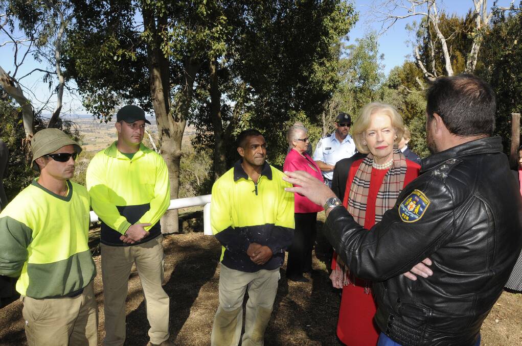 COMMUNITY: Bathurst Correctional Centre inmate Aveen Kumar speaks with Governor-General Quentin Bryce and Bathurst Correctional Centre’s governor Bill Fittler at the Wahluu Gamarra Reserve at Mount Panorama yesterday. Photo: CHRIS SEABROOK 051413cggv2