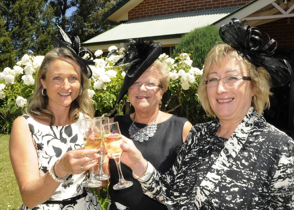 MELBOURNE CUP FEVER: Diana Hibberson, Jann Smith and Kim Meredith celebrated the Melbourne Cup in fine style at the Bathurst Convention Centre, where a fashion parade formed part of the occasion. Photo: CHRIS SEABROOK10513con4