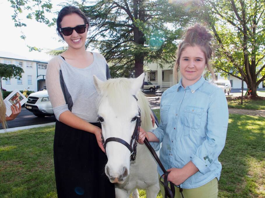ALL SAINTS' COLLEGE BLESSING OF THE ANIMALS: Indra Heslop and Lauren Selmes with Piglett.