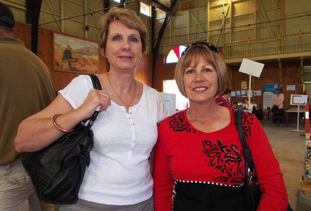 LIFELINE: Debbie Gore and Laura Caldwell look for a bargain at the book fair.