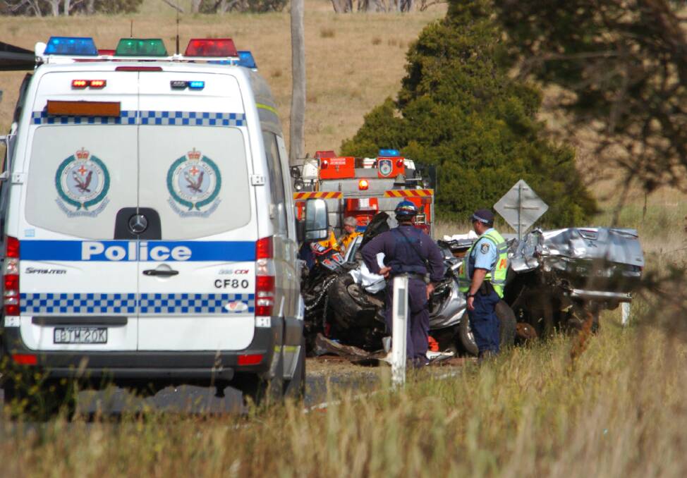 HIGHWAY TRAGEDY: Emergency services at the scene of a three-vehicle crash on the Great Western Highway this afternoon. Photo: ZENIO LAPKA 112412zcrash