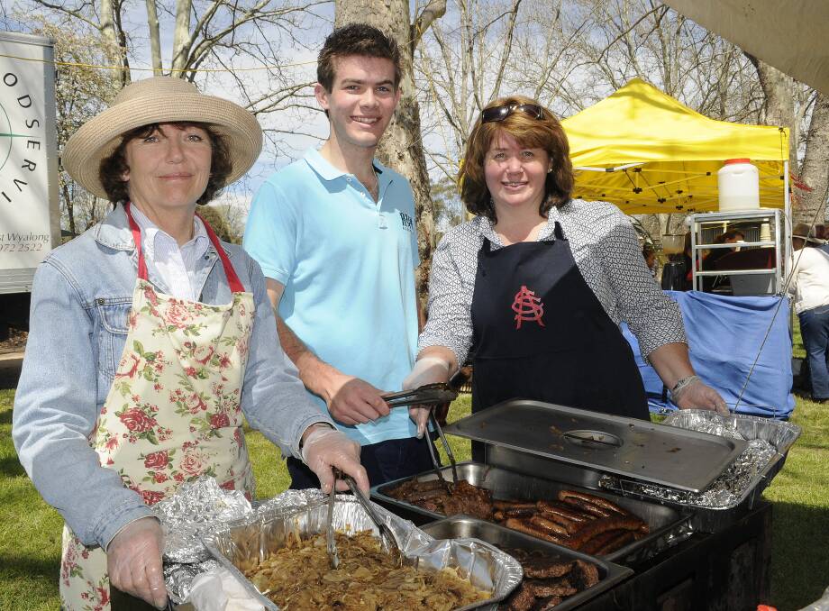ALL FIRED UP: Kaye Alamyar, Shaun Van Uum and Catherine Garment were on hand to man the barbecue at the All Saints’ College Spring Fair.
