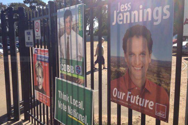 VOTE ONE: Political posters outside the polling booth at Bathurst West Public School today.