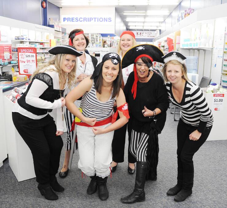 LET’S GO CRAZY: At back, Leone Finnis and Renee Kemp, with Jaimee Wellings, Hannah Heiner,  Mary-Lou Owens and Mel Duffy at John Matthews Pharmacy.