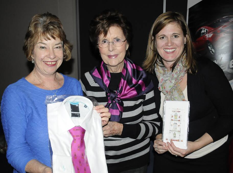 FUNDRAISER: Margaret Gibson, Diana and Caroline Ryan with some of the Cathedral Restoration Appeal merchandise.