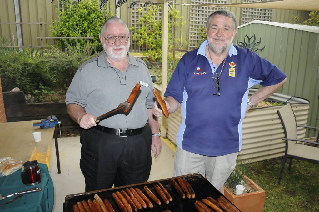 SEYMOUR CENTRE: Michael Maher with Lawrie Carter helped out cooking the barbecue lunch for everyone.