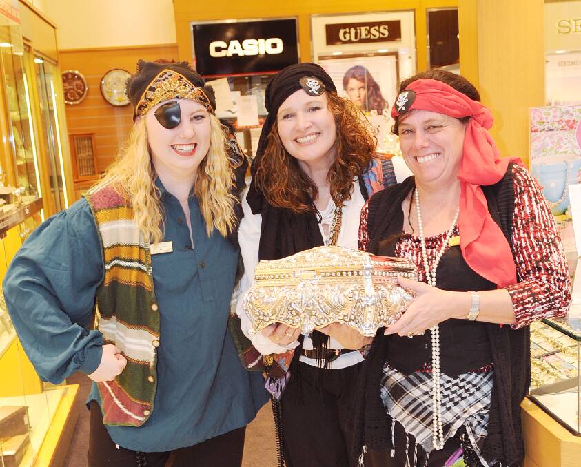 IT’S CRAZY: Taylor Zarnow, Mel Griffiths and Sharyn Mitselburg from Wallace Bishop enjoying the fun of Crazy Day.  