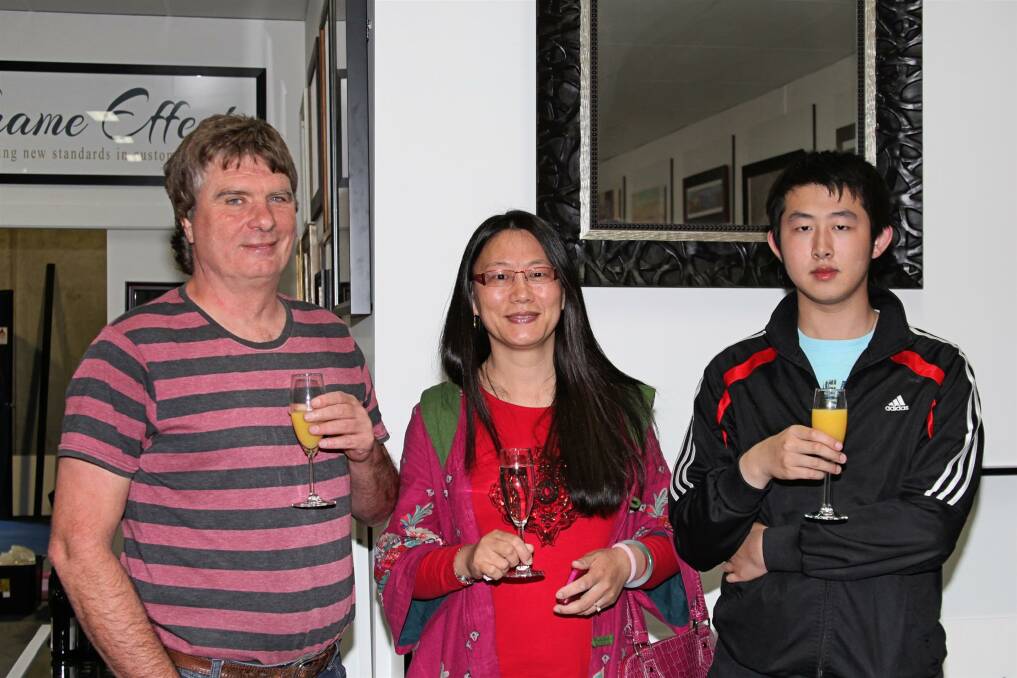 FRAME EFFECT GRAND OPENING: Robert Teirney, Hong Xia Zhang and Xian Hong Meng.