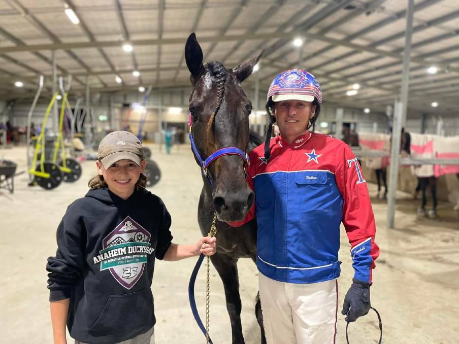Nathan Turnbull, pictured with son Jett, picked up three wins at Dubbo Showground on Friday night including the Peter Lew Memorial. Picture by Amy Rees