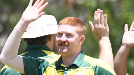 Rory Daburger celebrates one of his two wickets for Orange CYMS againast Bathurst City. Picture by Jude Keogh