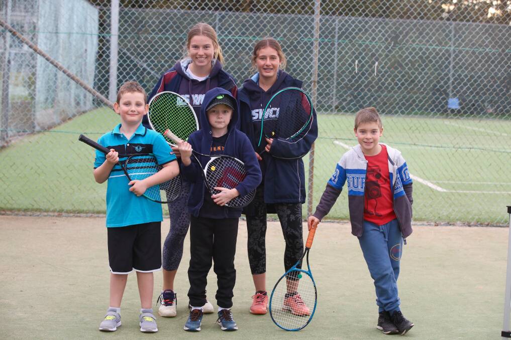 GRAND DREAMS: Coaches Tayla and Chloe Brasier with Cade, Hunter and Mitchell at the local tennis club. Photo: PHIL BLATCH
