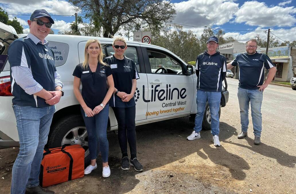 Lifeline staff and volunteers at Eugowra helping people cope with the devastation of the floods. Picture supplied by Lifeline Central West.