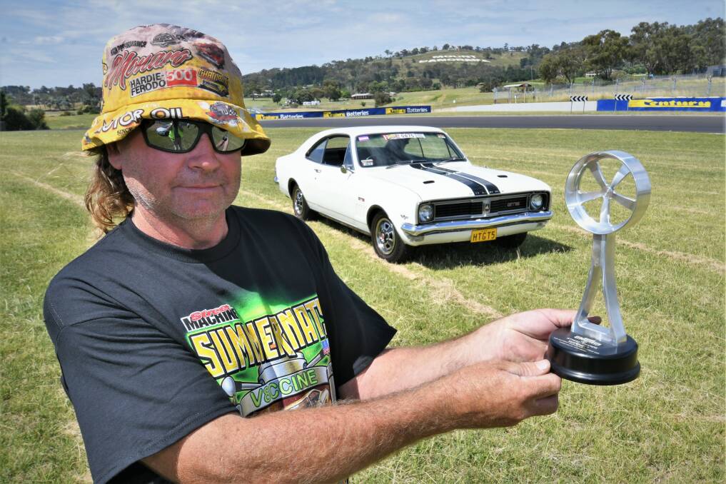 TROPHY CAR: Danny Board with his winning 1969 HT GTS Bathurst Monaro 350 after years of work. Photo: CHRIS SEABROOK