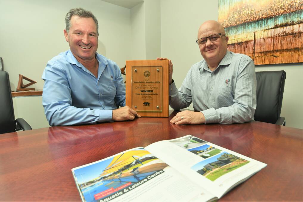 WINNERS: Managing director of Hines Constructions David Hines with construction manager Paddy Barber showing their prestigious award. Photo: CHRIS SEABROOK.