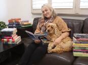 Lifeline Central West CEO Stephanie Robinson with Honey Crumpet checking out some of the books ahead of the Book Fair on May 2-5, 2024. Picture by Amy Rees
